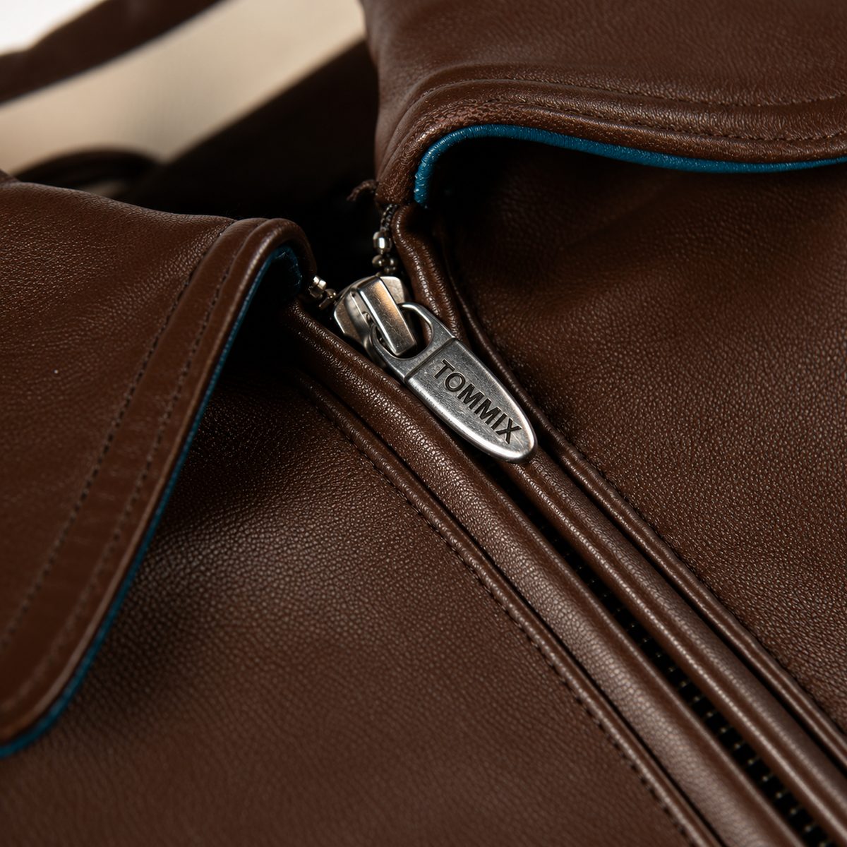 100% Genuine leather - Contrast color saddle seam leather sleeves  - Self leather with direct embroidered wearers left chest artwork  - Marc Buchanan "MB" leather applique branding with rhinestone branding on the wearers left sleeve  - Oversized 2 ply "Pelle Pelle" leather applique artwork with multiple rhinestone placements  - Satin lining with outlined direct embroidered "Pelle Pelle"  - Interior pockets at the inside lining  - Leather collar - Heavy 2x2 rib cuff and hem  - Pelle Pelle custom branded front zipper pull  (2)